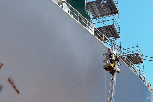 painter painting ship safely